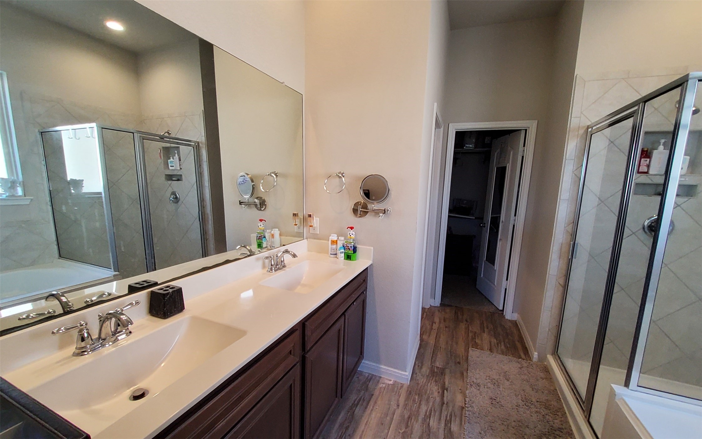 24418 Hollow Gate Meadow Court Spring, TX 77389 - Photo 27 of 45 a bathroom with a sink a mirror and a shower