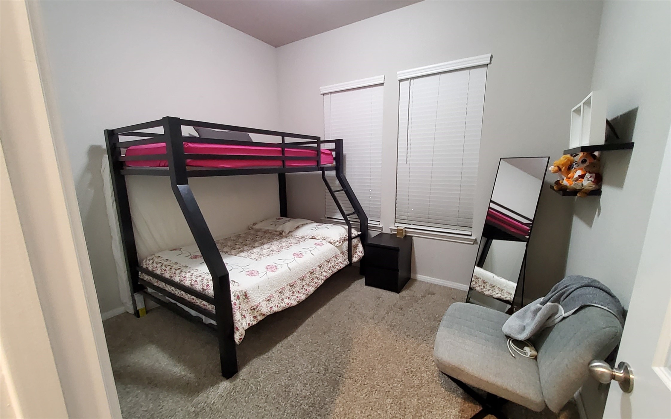 24418 Hollow Gate Meadow Court Spring, TX 77389 - Photo 30 of 45 a bedroom with a bed and a mirror