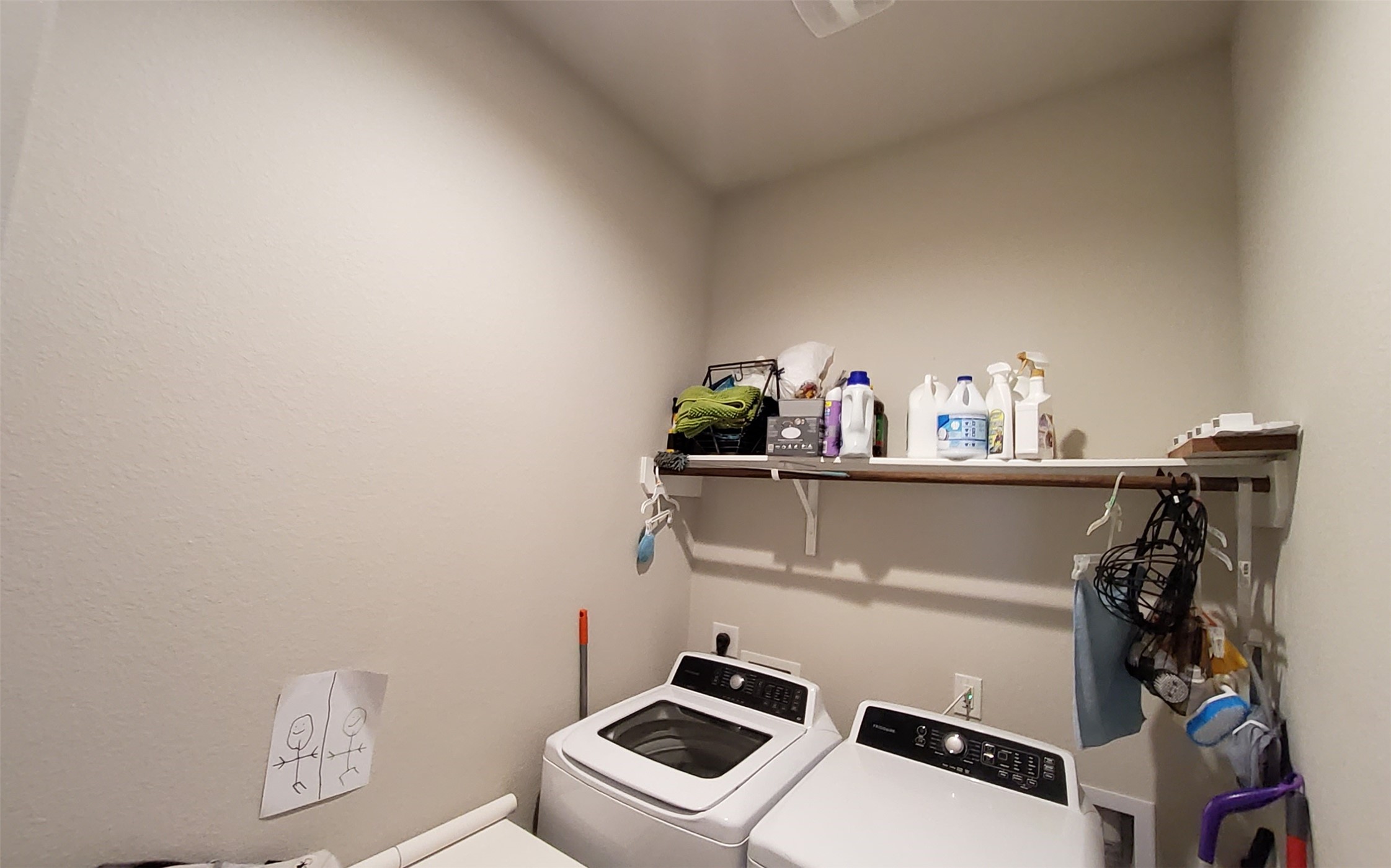 24418 Hollow Gate Meadow Court Spring, TX 77389 - Photo 33 of 45 a view of storage and utility room with washer and dryer