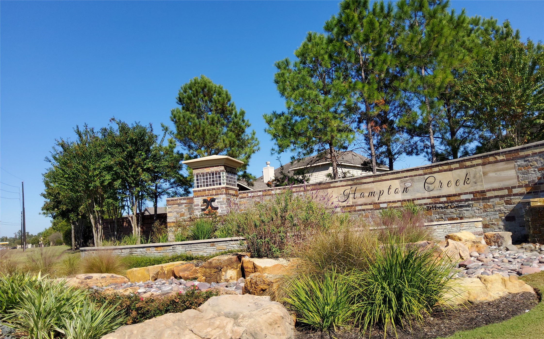 24418 Hollow Gate Meadow Court Spring, TX 77389 - Photo 35 of 45 a view of a lake with a house in the background