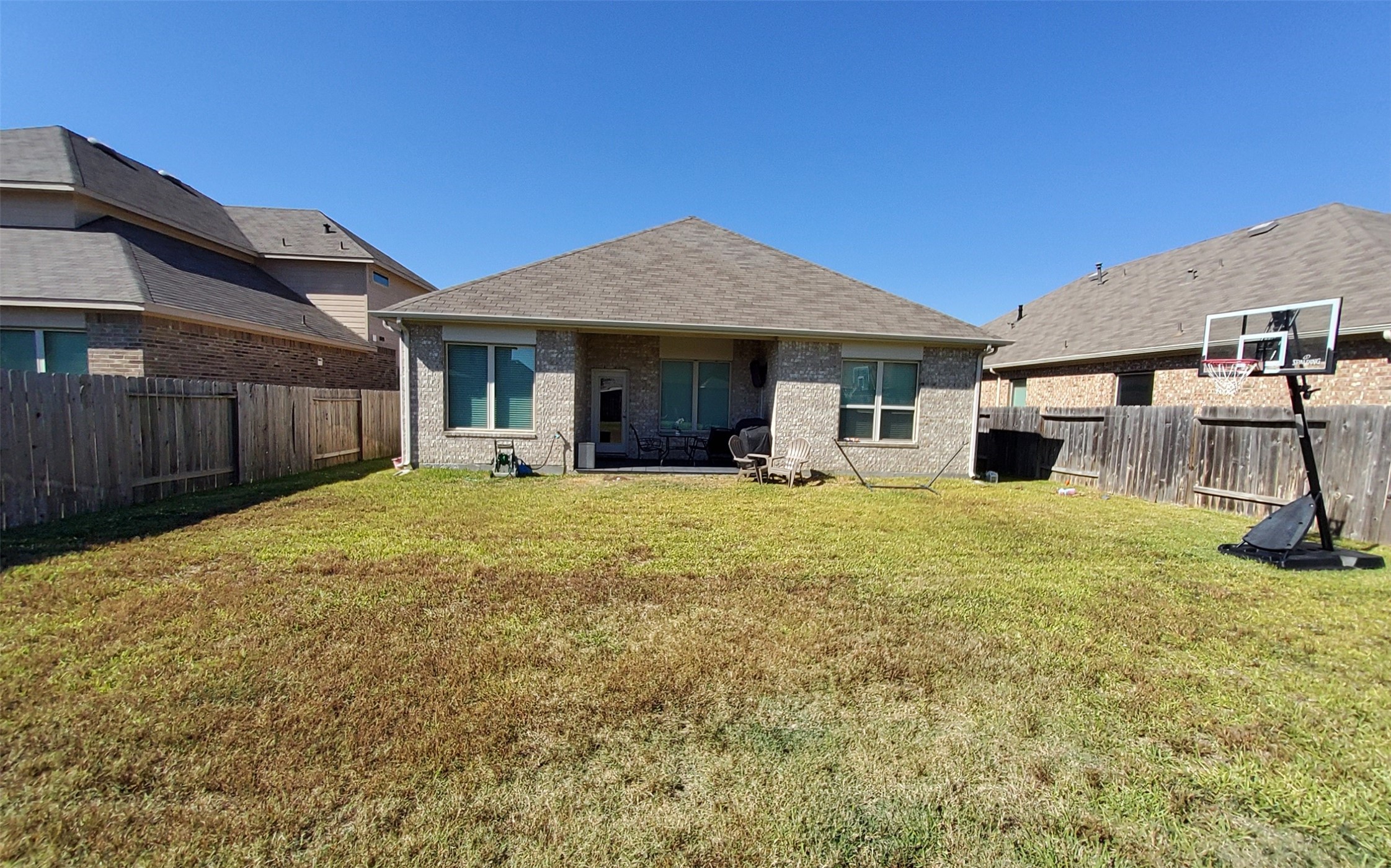 24418 Hollow Gate Meadow Court Spring, TX 77389 - Photo 37 of 45 a front view of a house with a yard and garage
