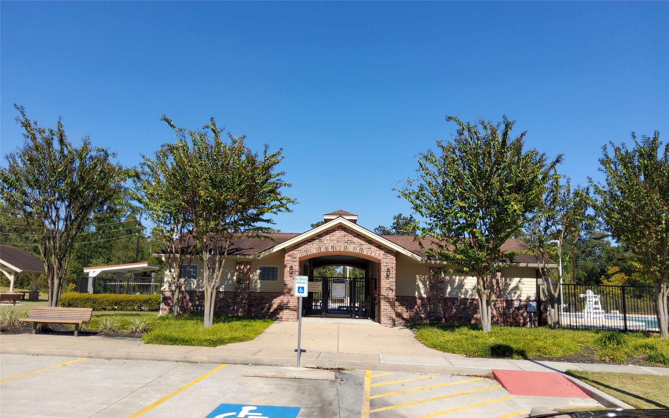 24418 Hollow Gate Meadow Court Spring, TX 77389 - Photo 41 of 45 a front view of a house with a garden and a tree