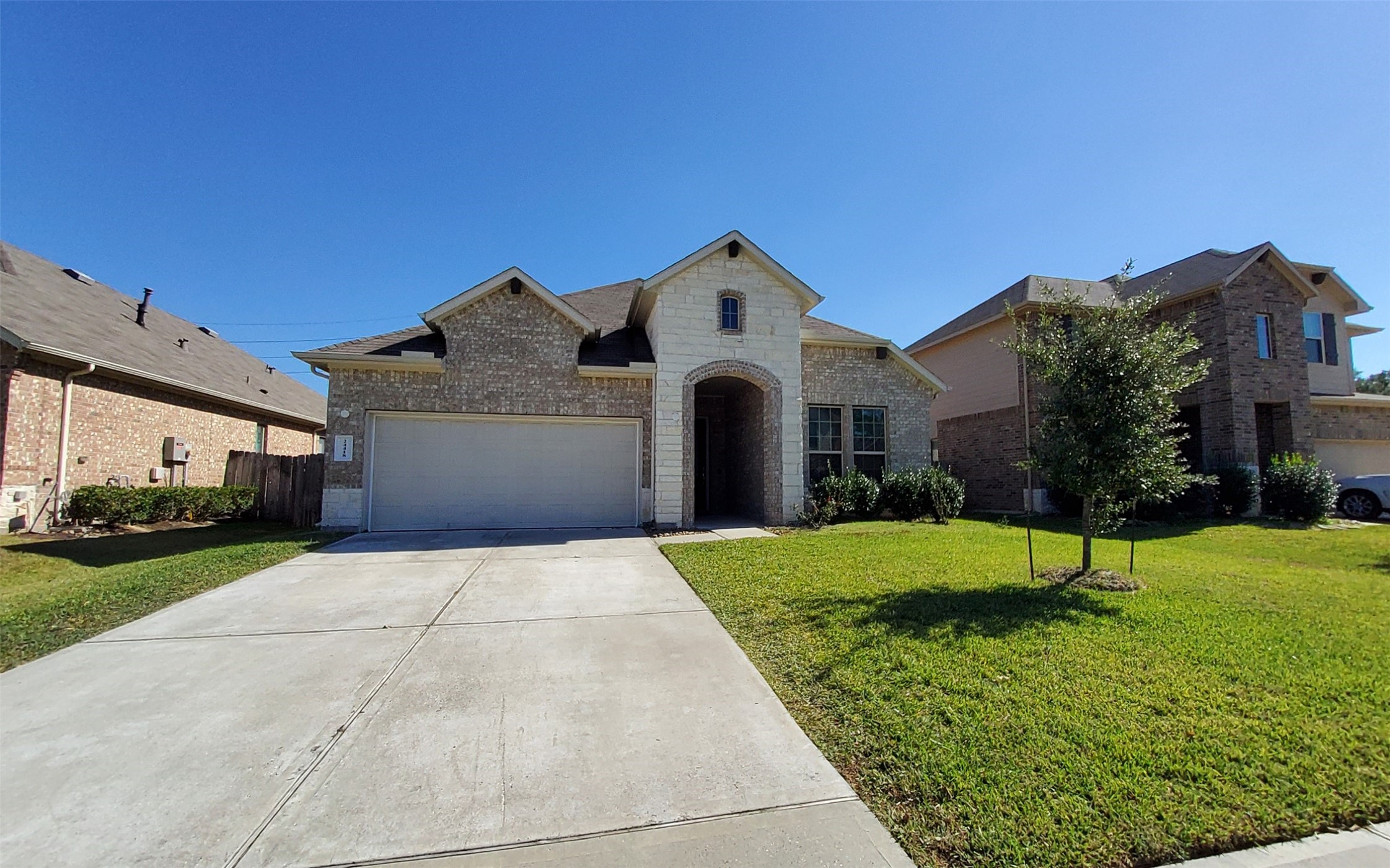 24418 Hollow Gate Meadow Court Spring, TX 77389 - Photo 5 of 45 a front view of a house with a yard