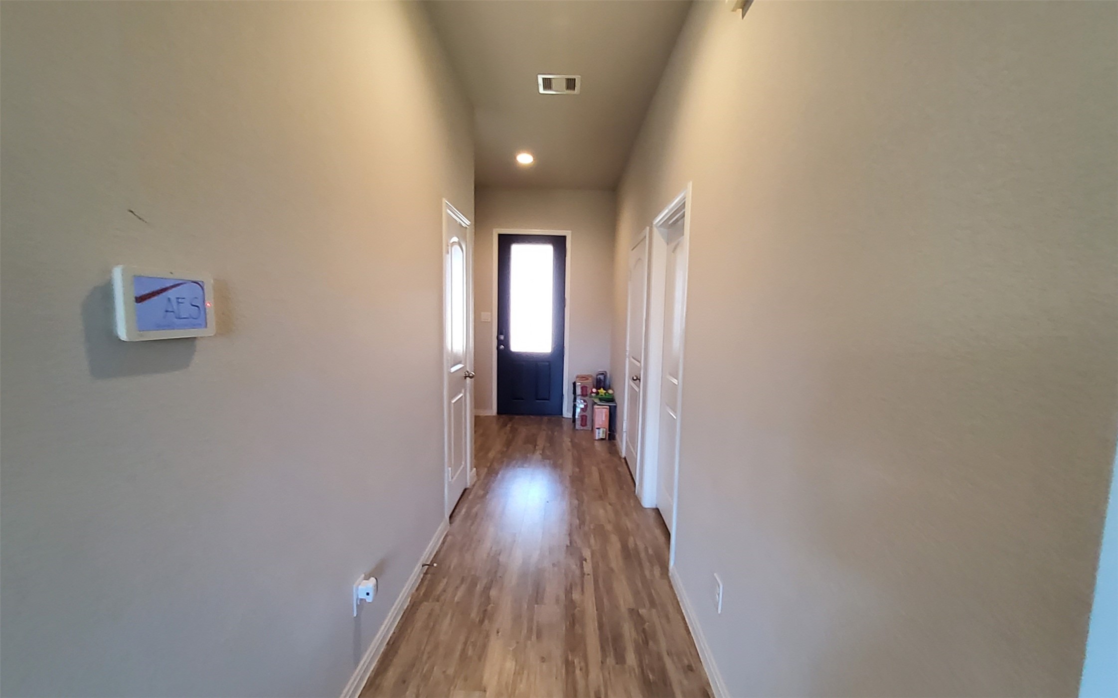24418 Hollow Gate Meadow Court Spring, TX 77389 - Photo 9 of 45 a view of a hallway with wooden floor