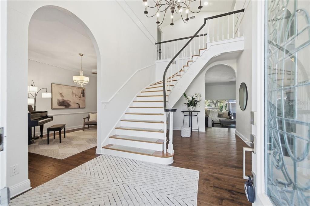 3049 Geiger Court Clearwater, FL 33761 - Photo 11 of 90 a view of entryway and hall with wooden floor
