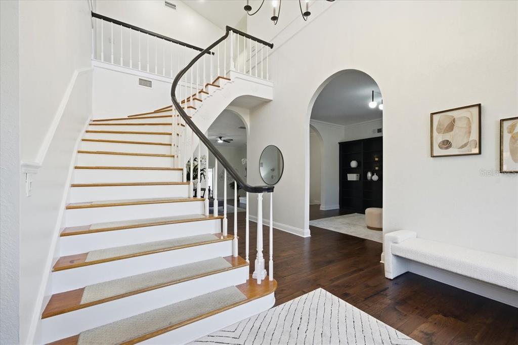 3049 Geiger Court Clearwater, FL 33761 - Photo 13 of 90 a view of entryway and hall with wooden floor