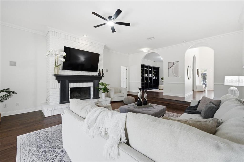 3049 Geiger Court Clearwater, FL 33761 - Photo 25 of 90 a living room with fireplace furniture and a flat screen tv