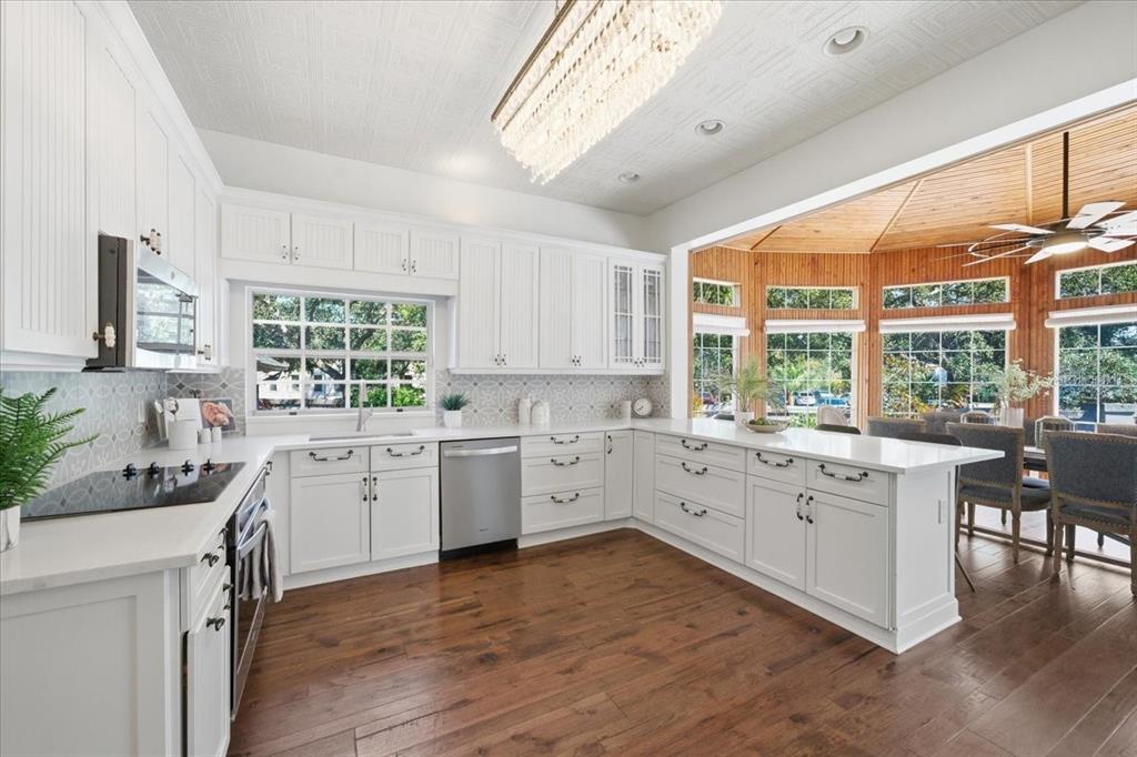 3049 Geiger Court Clearwater, FL 33761 - Photo 33 of 90 a kitchen with a sink windows and cabinets