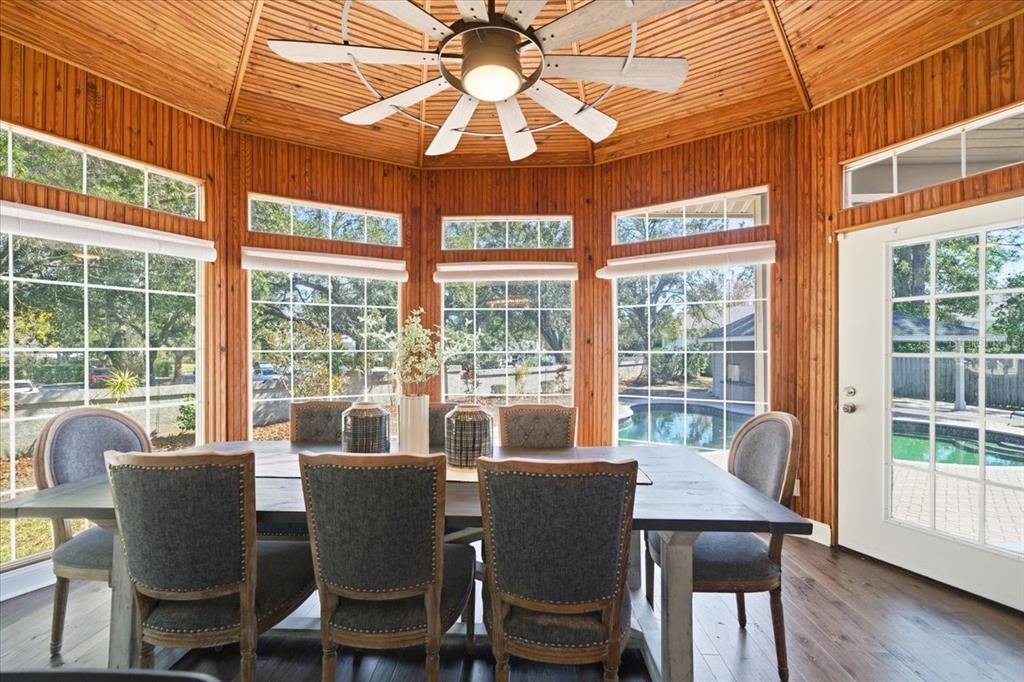 3049 Geiger Court Clearwater, FL 33761 - Photo 36 of 90 a dining room with furniture a chandelier and wooden floor