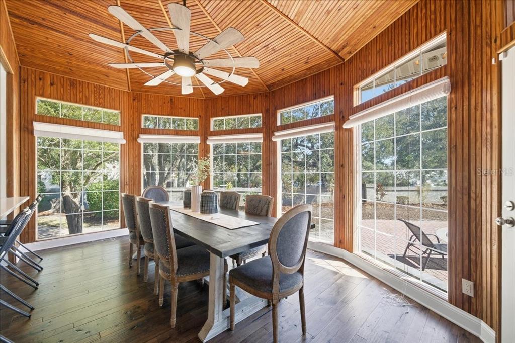 3049 Geiger Court Clearwater, FL 33761 - Photo 37 of 90 a dining room with furniture window and wooden floor