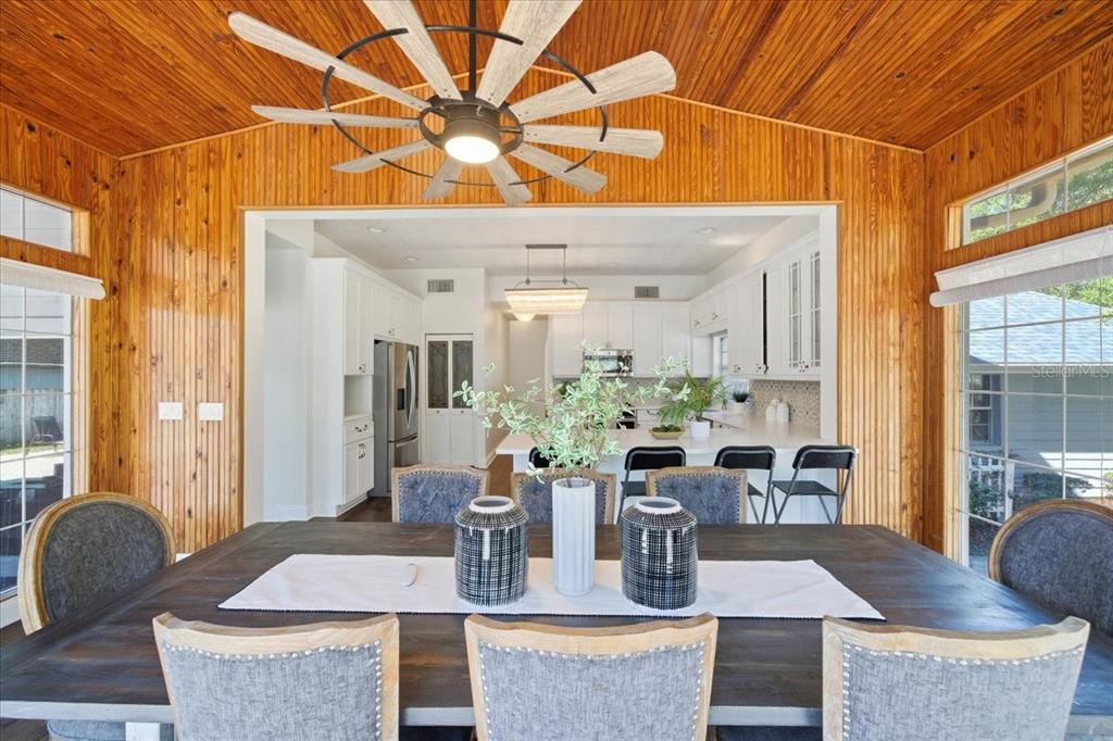 3049 Geiger Court Clearwater, FL 33761 - Photo 39 of 90 a dining room with furniture and wooden floor