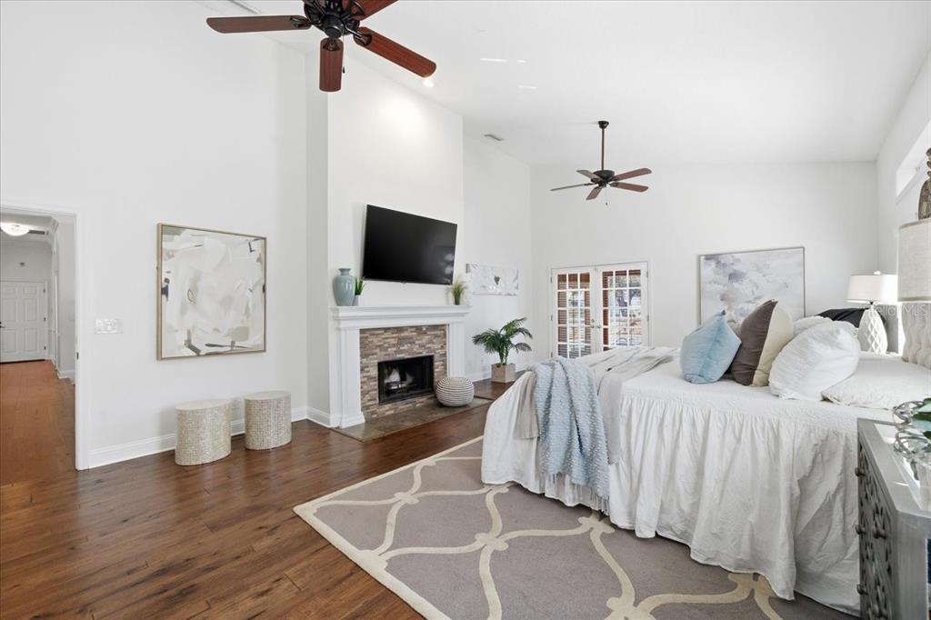 3049 Geiger Court Clearwater, FL 33761 - Photo 42 of 90 a spacious bedroom with a bed and a flat screen tv