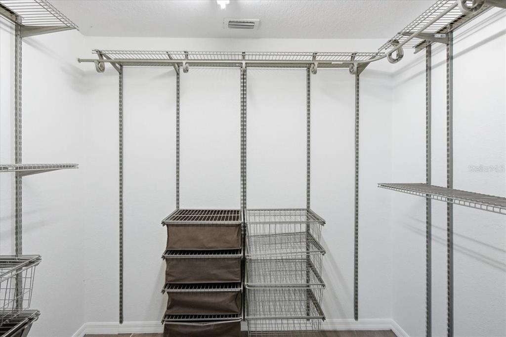 3049 Geiger Court Clearwater, FL 33761 - Photo 46 of 90 a bathroom with a shower and a glass door