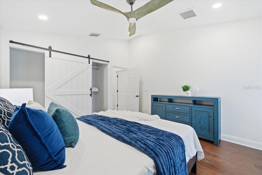 3049 Geiger Court Clearwater, FL 33761 - Photo 66 of 90 a bedroom with a bed and a dresser