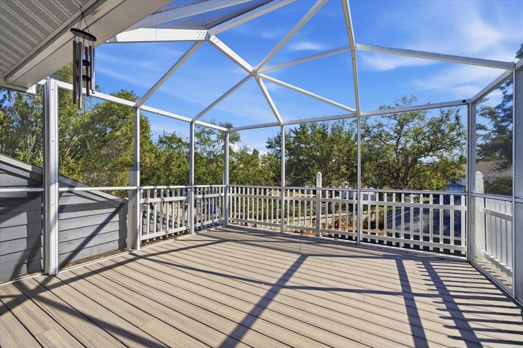 3049 Geiger Court Clearwater, FL 33761 - Photo 67 of 90 a view of a wooden deck with a yard