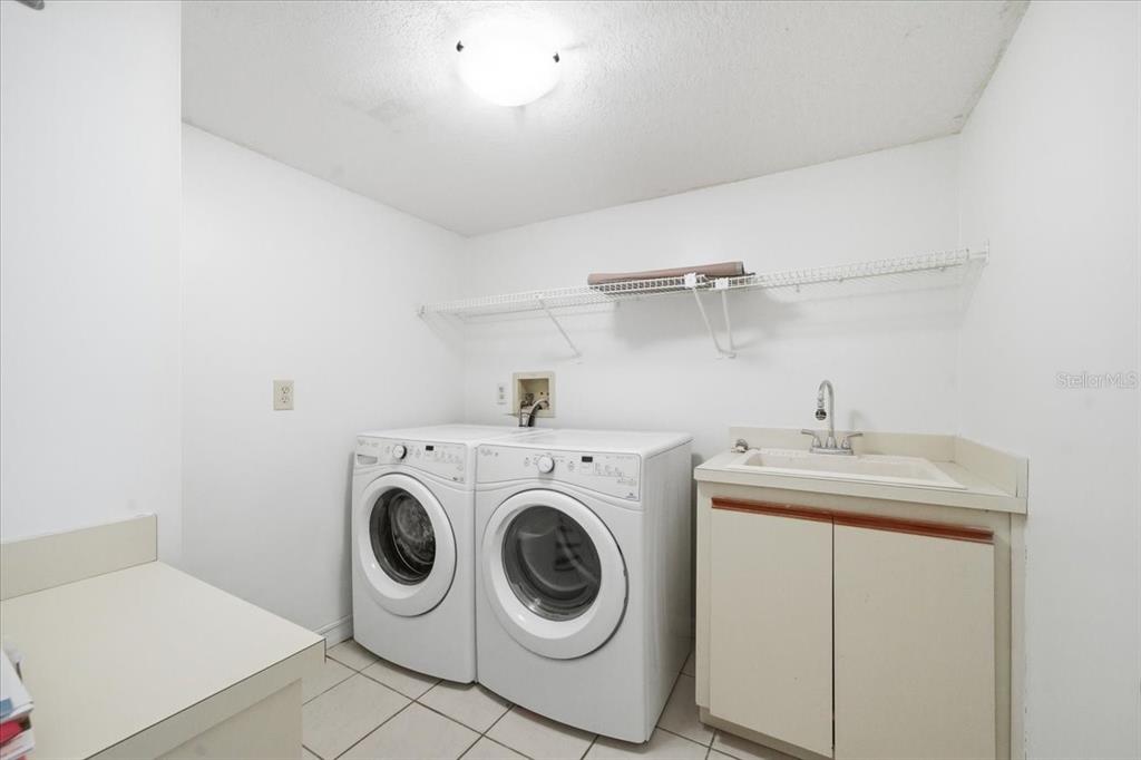 3049 Geiger Court Clearwater, FL 33761 - Photo 71 of 90 a utility room with sink dryer and washer