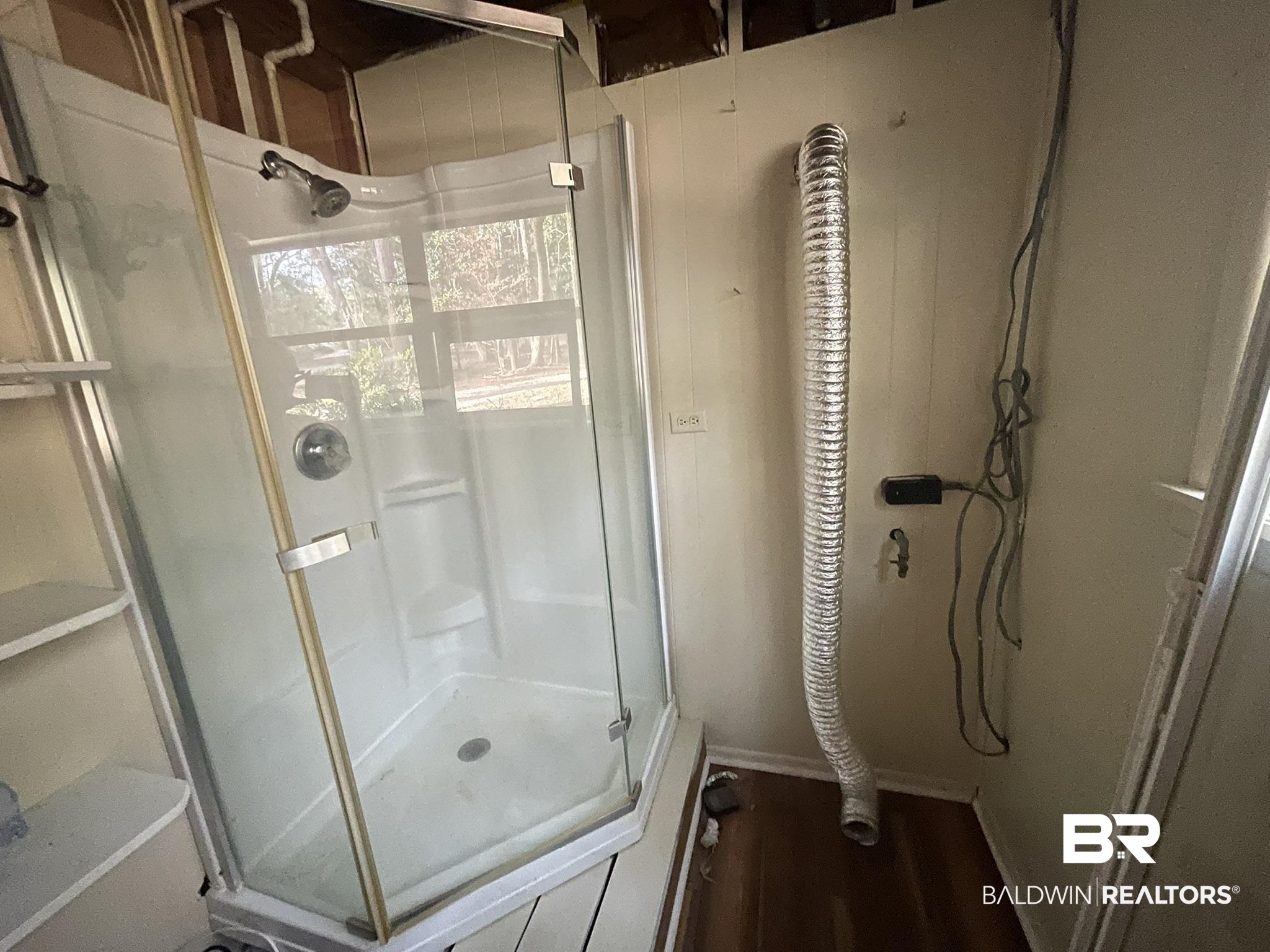 6621 Purvis Road Daphne, AL 36527 - Photo 47 of 59 Full bathroom with a stall shower, dark wood-type flooring, and wood walls