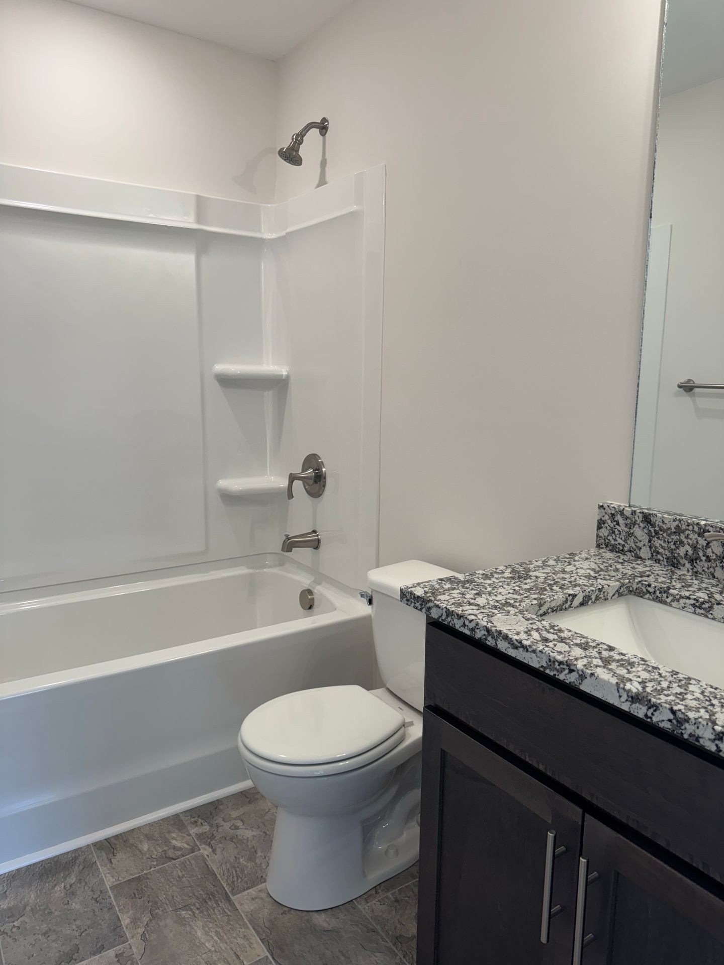 130 Quarry Point Drive Clarksville, TN 37043 - Photo 20 of 21 a bathroom with a granite countertop bathtub sink vanity mirror and toilet