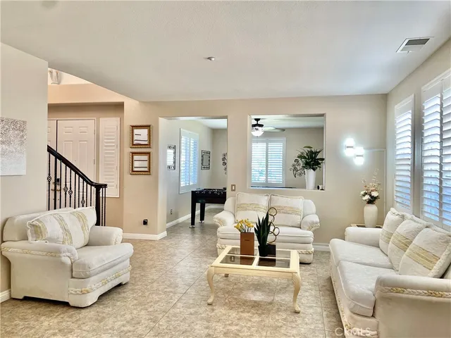 a kitchen with stainless steel appliances granite countertop a sink a stove and cabinets