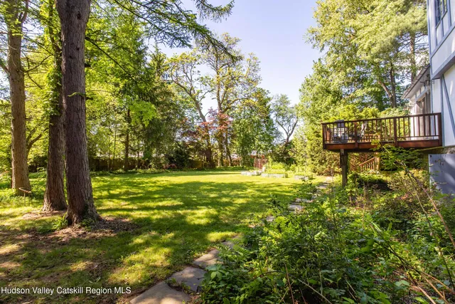 a bedroom with a bed dresser and a window