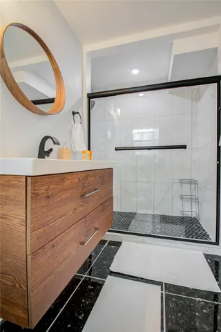 a bathroom with a sink and a mirror