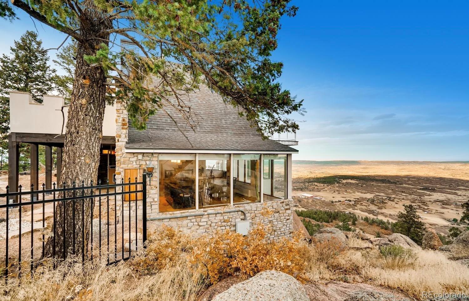 1150 North Madge Gulch Road Sedalia, CO 80135 - Photo 11 of 49 a view of a balcony with an ocean view