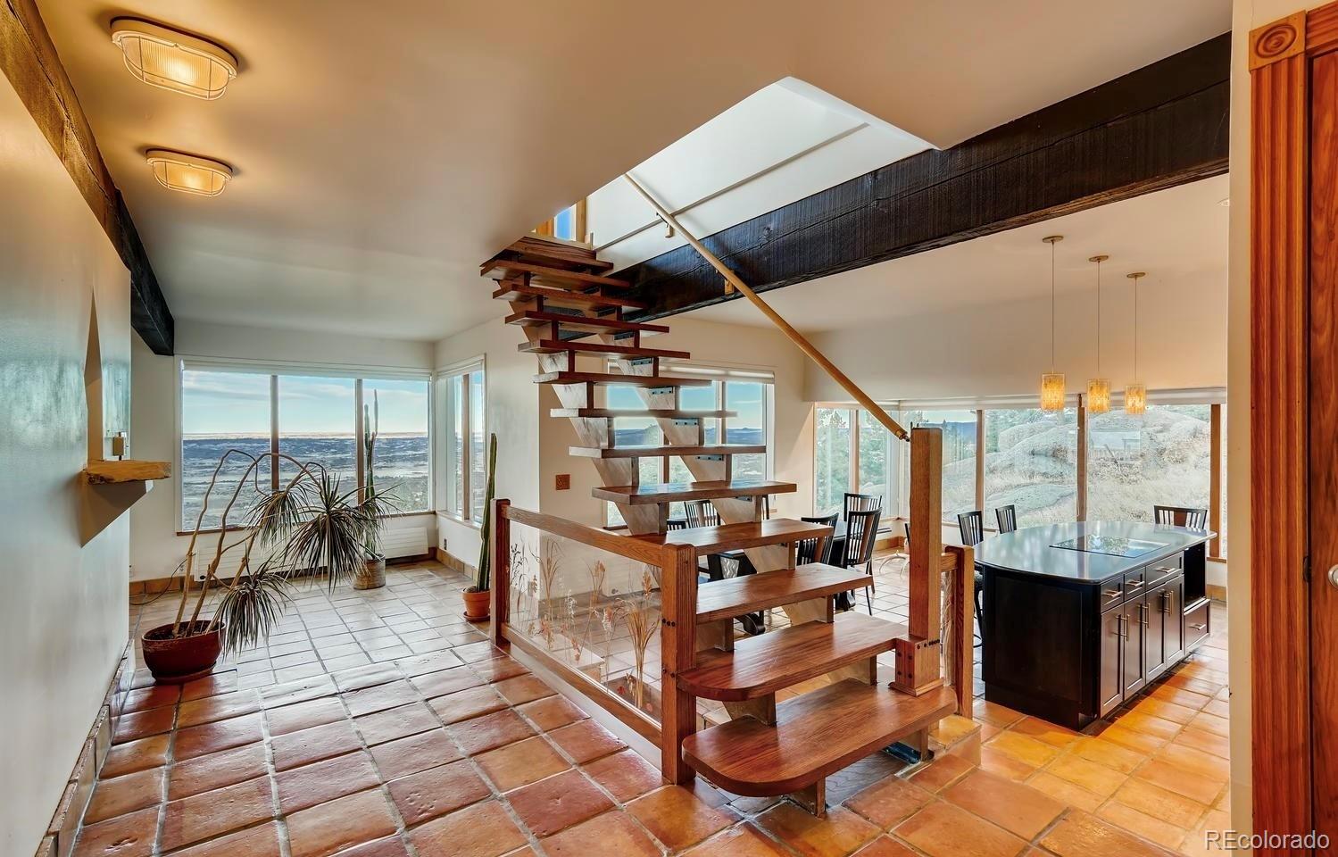 1150 North Madge Gulch Road Sedalia, CO 80135 - Photo 22 of 49 a view of living room with balcony