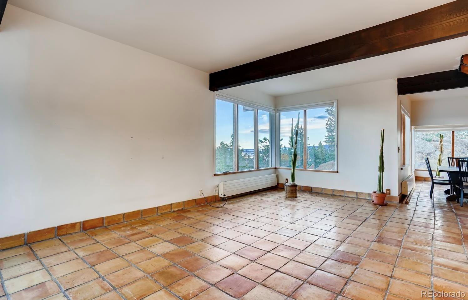 1150 North Madge Gulch Road Sedalia, CO 80135 - Photo 28 of 49 a view of an empty room with window