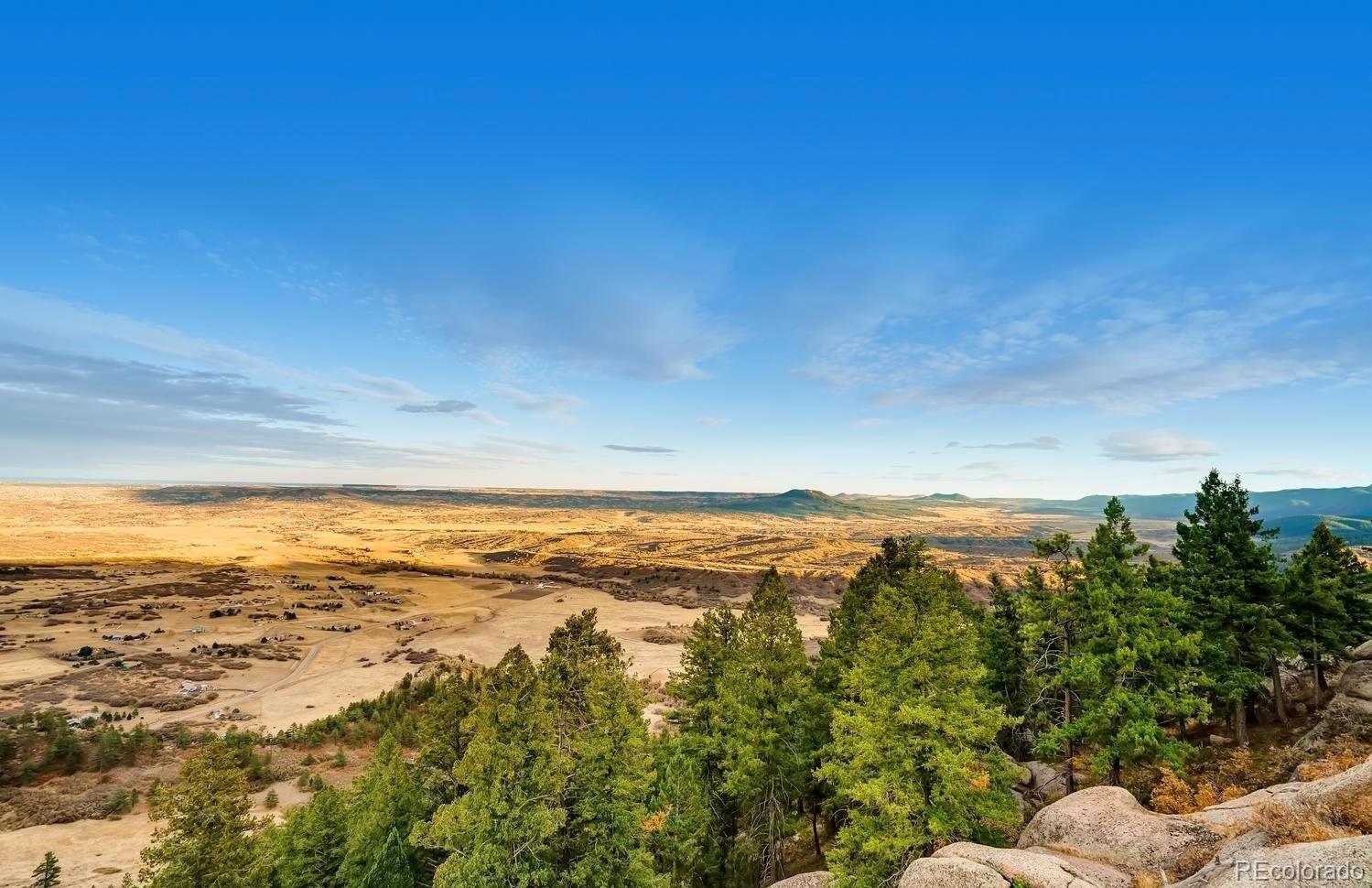 1150 North Madge Gulch Road Sedalia, CO 80135 - Photo 3 of 49 a view of an ocean