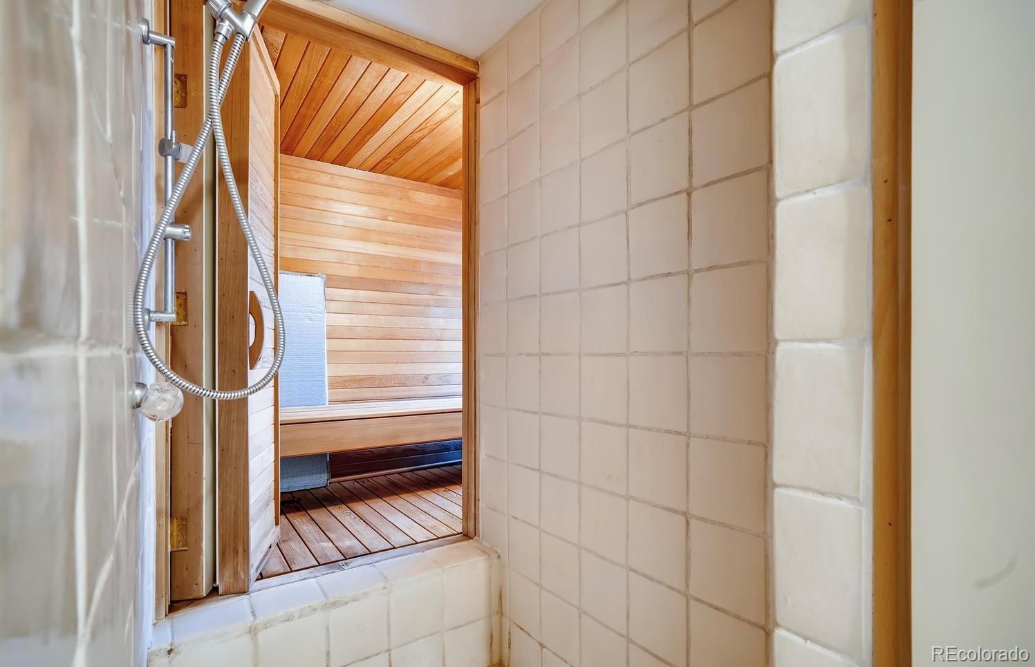 1150 North Madge Gulch Road Sedalia, CO 80135 - Photo 33 of 49 a bathroom with a shower