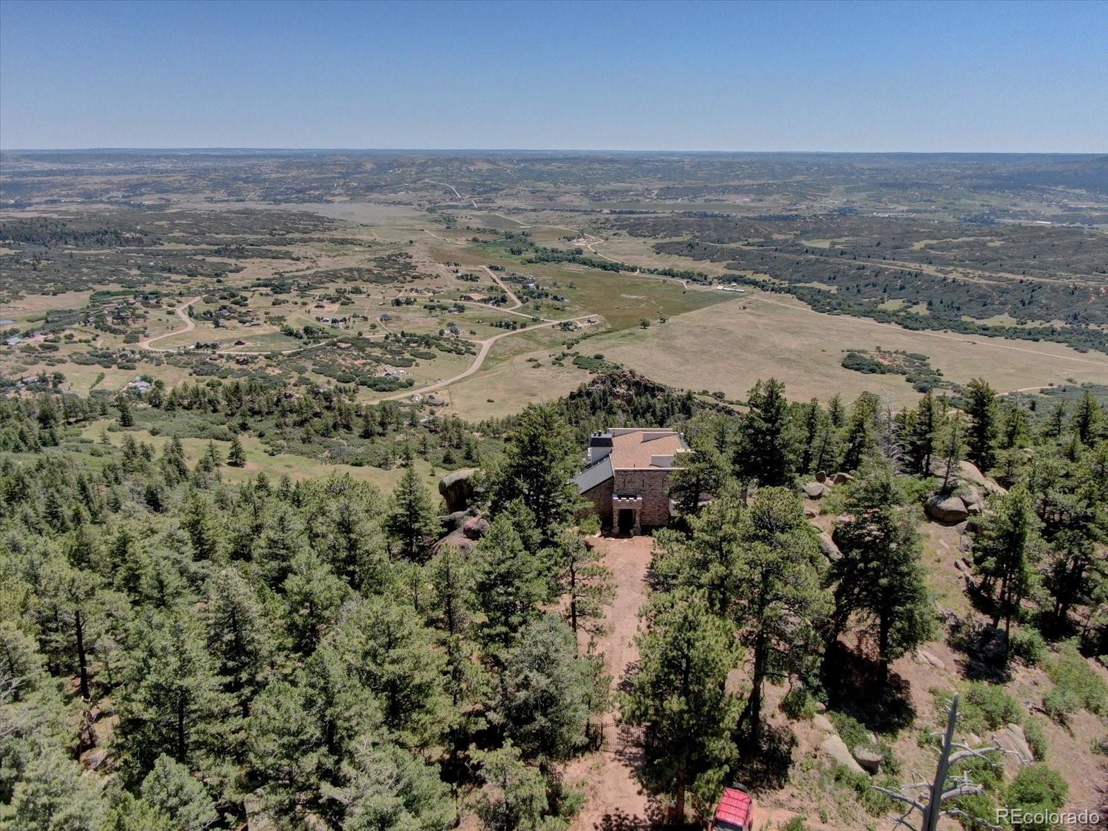 1150 North Madge Gulch Road Sedalia, CO 80135 - Photo 43 of 49 an aerial view of ocean and residential houses with outdoor space