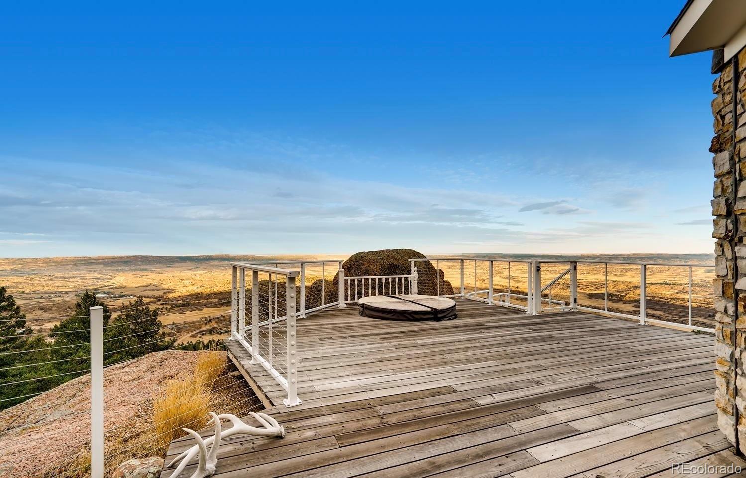 1150 North Madge Gulch Road Sedalia, CO 80135 - Photo 10 of 49 a view of a balcony with ocean view