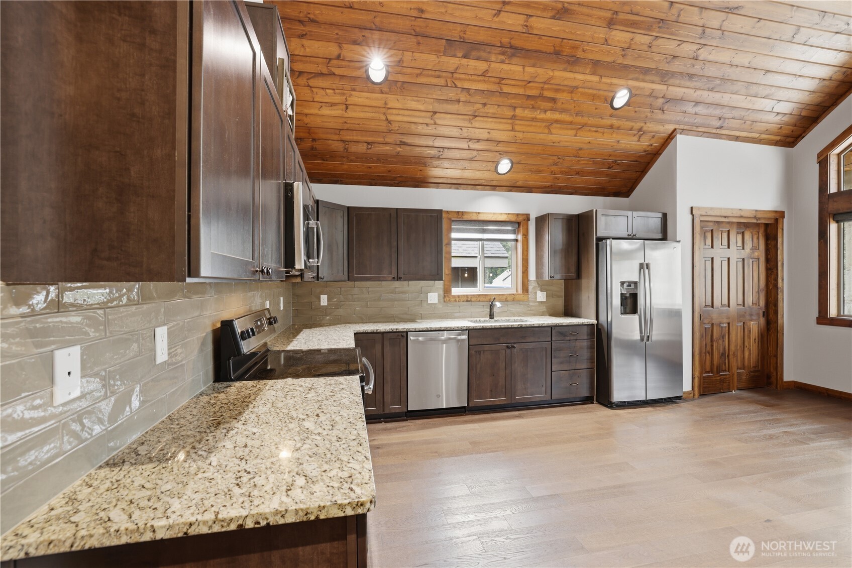90 Rockberry Loop Ronald, WA 98940 - Photo 13 of 40 a kitchen with stainless steel appliances granite countertop a sink window and refrigerator