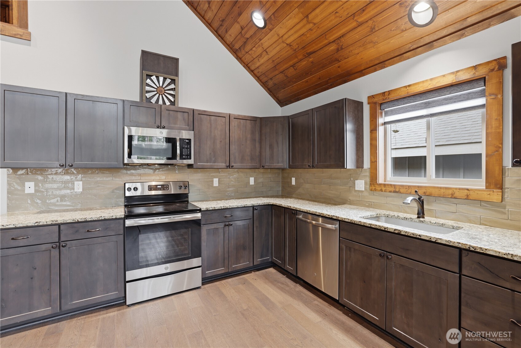 90 Rockberry Loop Ronald, WA 98940 - Photo 14 of 40 a kitchen with stainless steel appliances granite countertop a sink stove and microwave