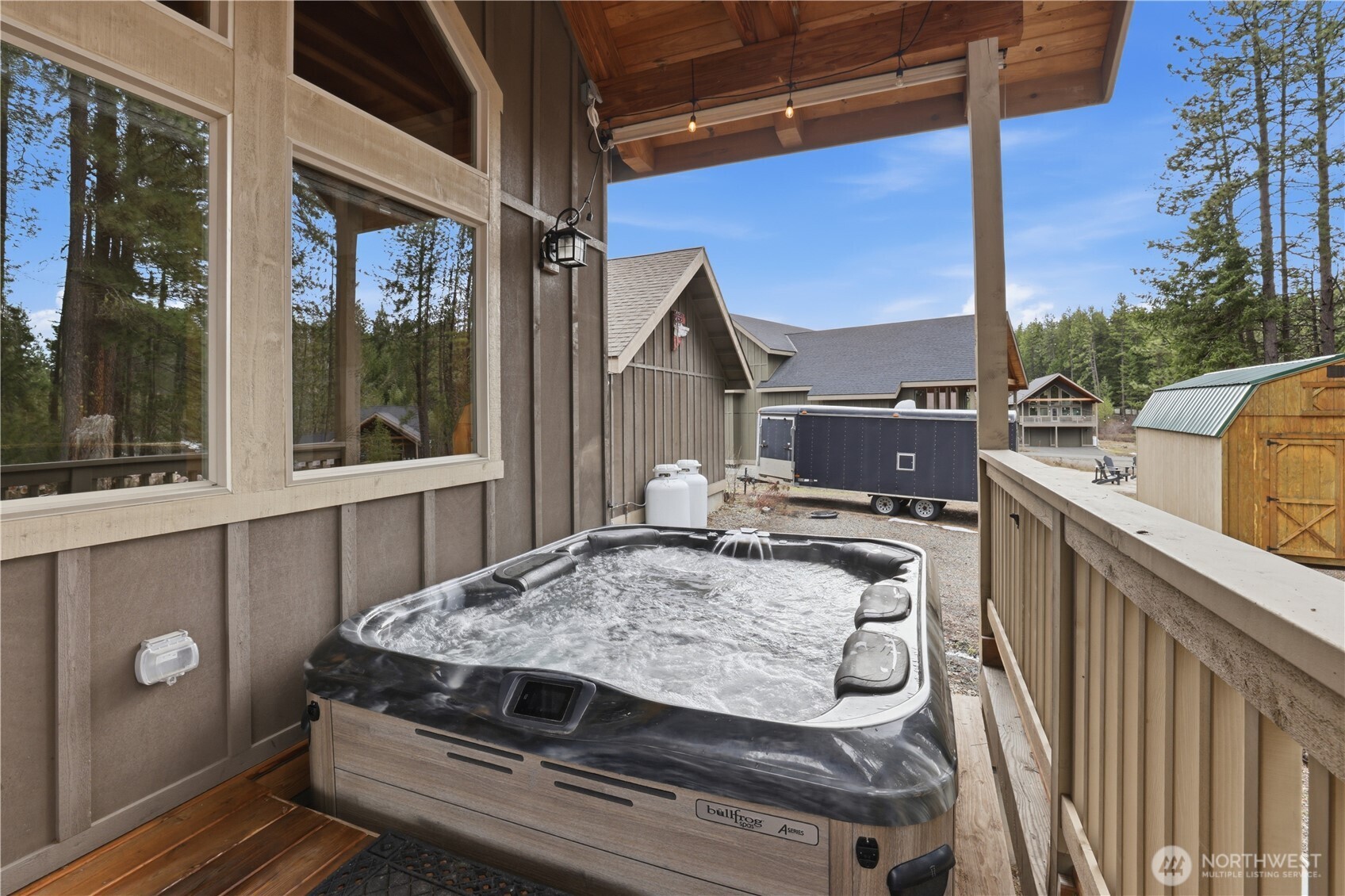 90 Rockberry Loop Ronald, WA 98940 - Photo 24 of 40 a roof deck with table and chairs a barbeque