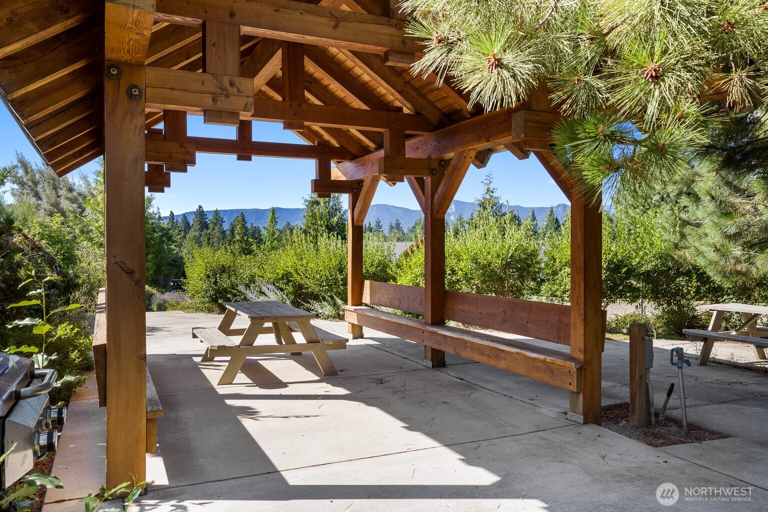 90 Rockberry Loop Ronald, WA 98940 - Photo 37 of 40 a patio with table and chairs and potted plants