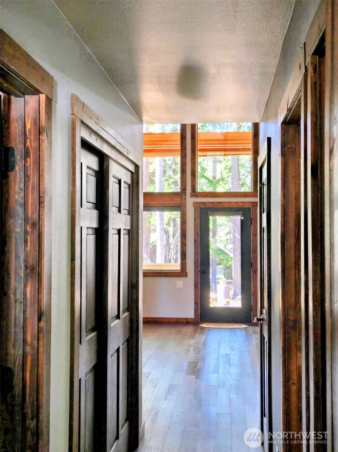 90 Rockberry Loop Ronald, WA 98940 - Photo 8 of 40 a view of an entryway with wooden floor and windows