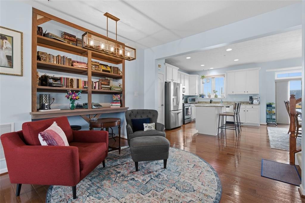 44 Coolidge Drive McKees Rocks, PA 15136 - Photo 12 of 36 a living room with furniture a rug and kitchen view