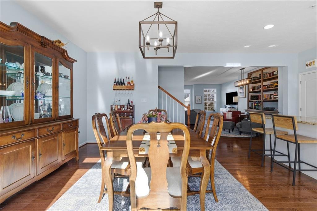 44 Coolidge Drive McKees Rocks, PA 15136 - Photo 16 of 36 a view of a dining room with furniture a chandelier and wooden floor