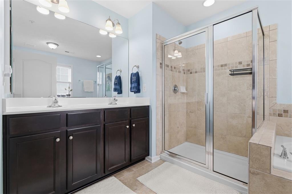 44 Coolidge Drive McKees Rocks, PA 15136 - Photo 20 of 36 a bathroom with a double vanity sink mirror and shower