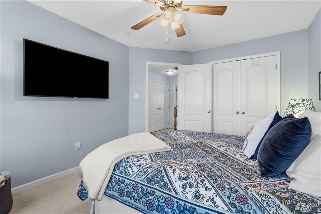 44 Coolidge Drive McKees Rocks, PA 15136 - Photo 25 of 36 a bedroom with a large bed and a flat screen tv