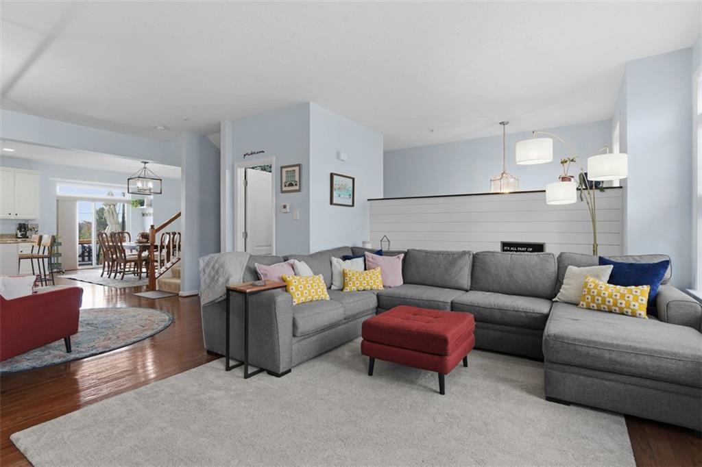 44 Coolidge Drive McKees Rocks, PA 15136 - Photo 9 of 36 a living room with furniture a rug and a chandelier