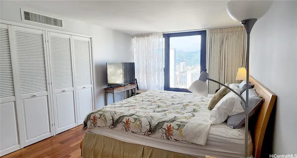 a bed room with a bed and a night stand
