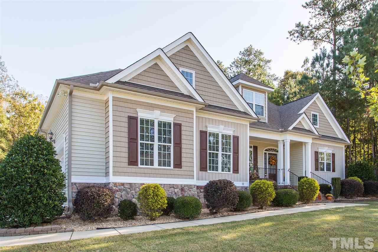 12 Vista Ridge Drive Willow Spring, NC 27592 - Photo 2 of 30 You will enjoy touring this gorgeous custom home which boasts many upgrades. Home features hardwood floors, new carpet, heavy trim and moldings, granite counter-tops, mudroom, first floor laundry and a screened-in porch.