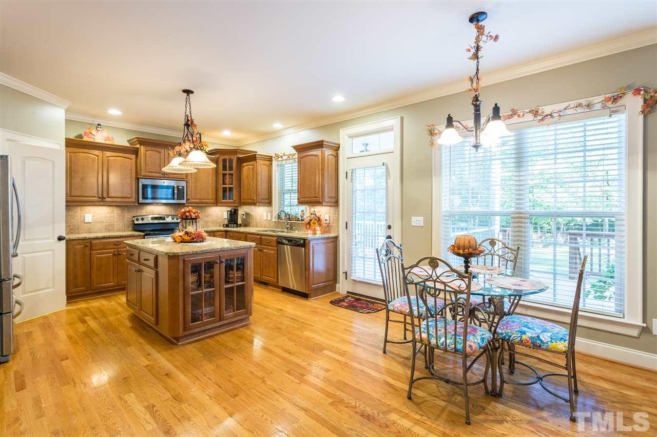 12 Vista Ridge Drive Willow Spring, NC 27592 - Photo 11 of 30 You will enjoy your morning cup of coffee in this bright and cheerful breakfast room for a great start to your day. Room boasts a large double window to let in additional lighting and features an oil rubbed bronze light fixture and hardwood floors.