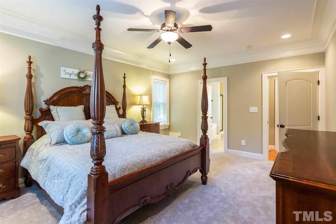 12 Vista Ridge Drive Willow Spring, NC 27592 - Photo 16 of 30 You will rest well in this elegant first floor master bedroom which boasts heavy trim, recessed lighting, 2" blinds, and new carpet. A ceiling fan with light kit is provided for your convenience and comfort.