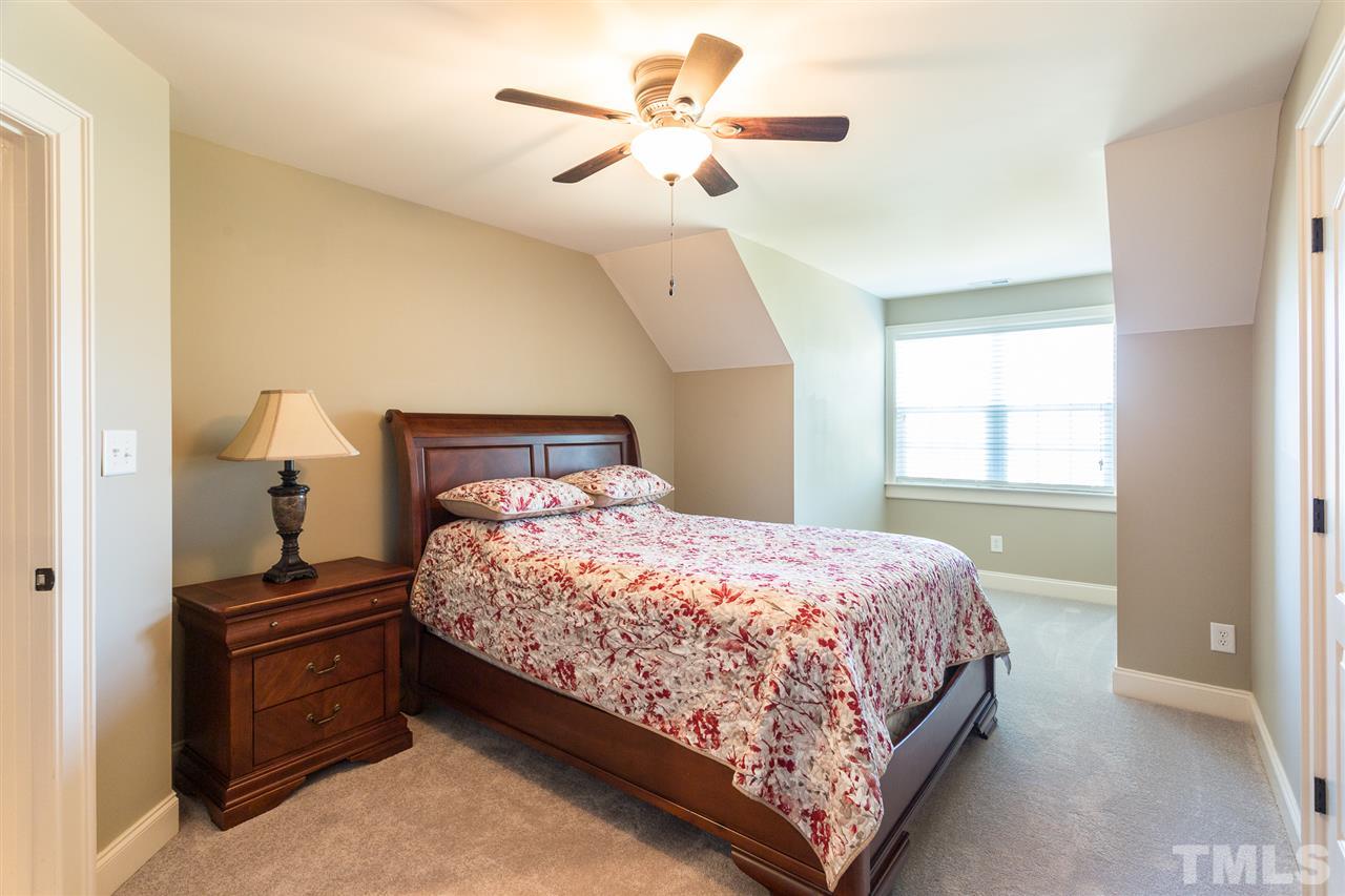 12 Vista Ridge Drive Willow Spring, NC 27592 - Photo 20 of 30 Your guests will rest well in this spacious upstairs bedroom with the hall bath located nearby. Room features new carpet, smooth ceilings with fan and light kit, double windows and a spacious closet with alcove access.