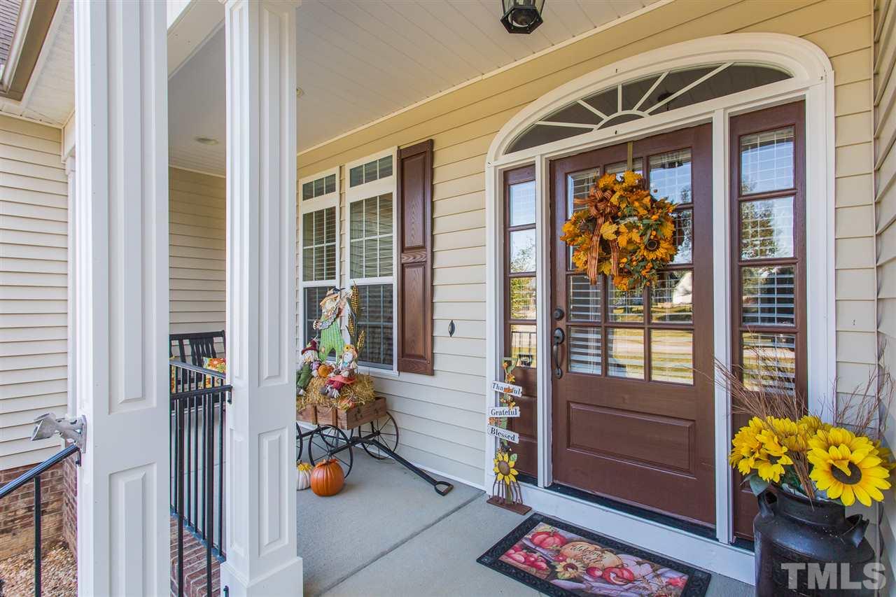 12 Vista Ridge Drive Willow Spring, NC 27592 - Photo 3 of 30 You will enjoy relaxing on this rocking chair front porch after a long day's work.