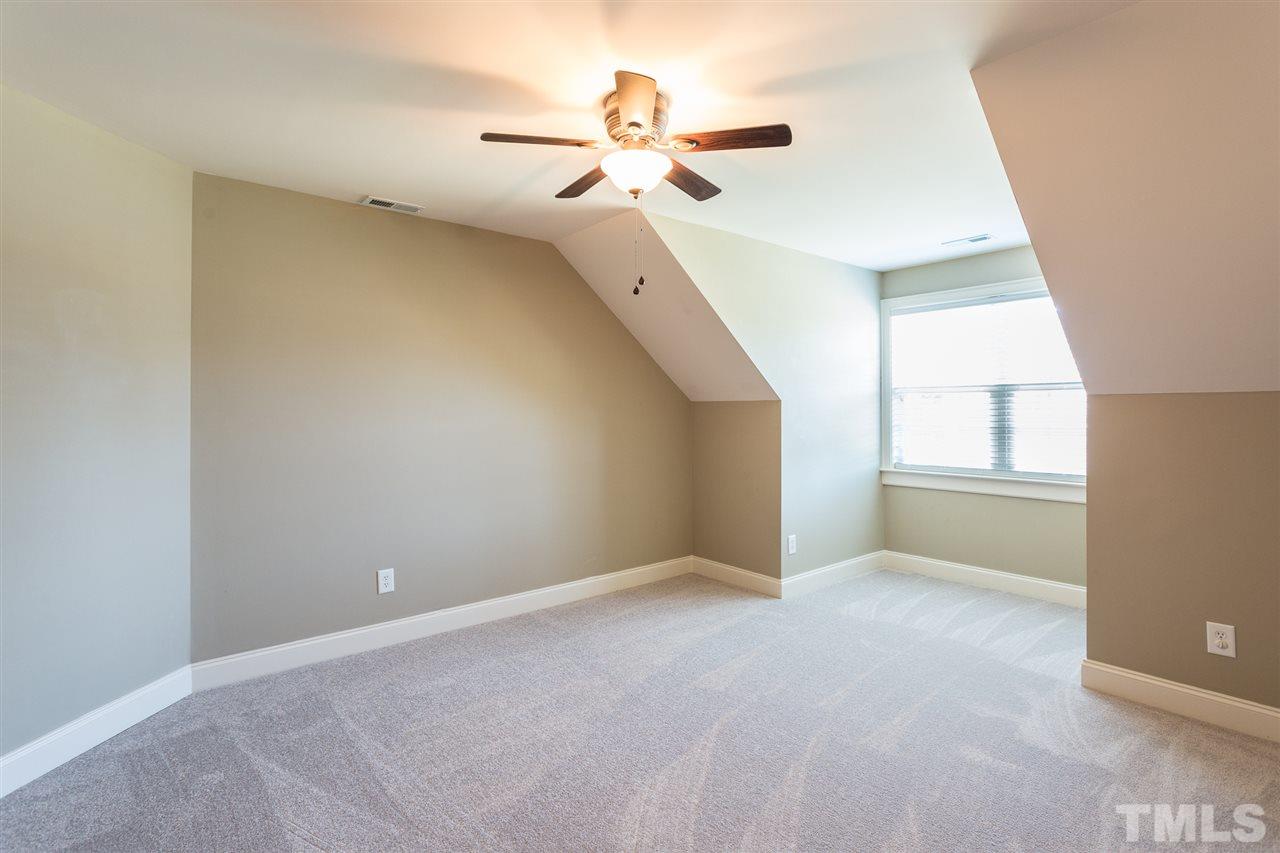 12 Vista Ridge Drive Willow Spring, NC 27592 - Photo 21 of 30 This second floor bedroom awaits your personal touches and furnishings to make it your own. Room features new carpet, smooth ceilings with fan and light kit, and a walk-in closet with wood shelving.