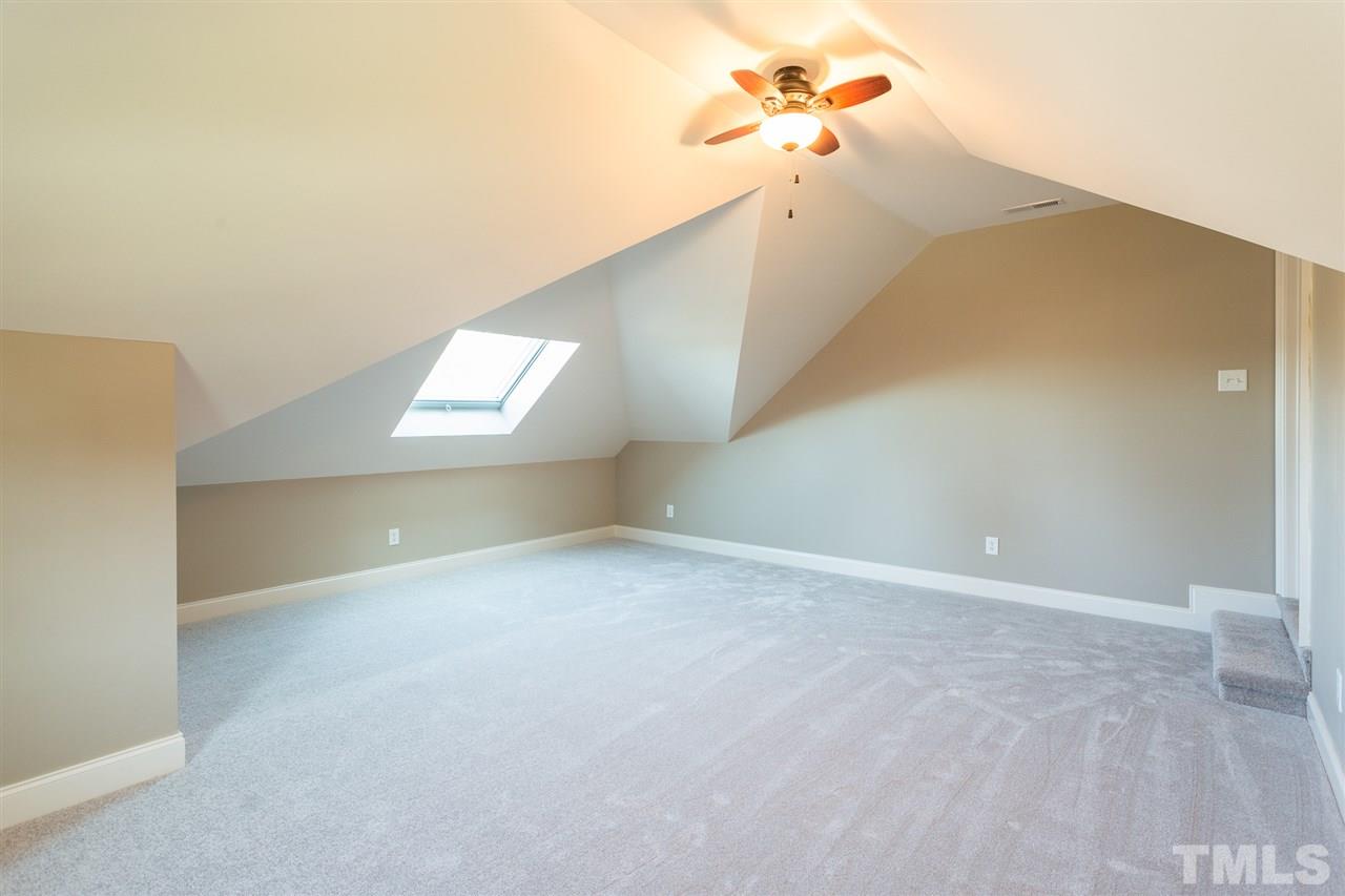 12 Vista Ridge Drive Willow Spring, NC 27592 - Photo 24 of 30 This lovely and spacious bonus room offers options for its usage and furniture placement. Room boasts new carpet, a skylight and a ceiling fan for your convenience and comfort.